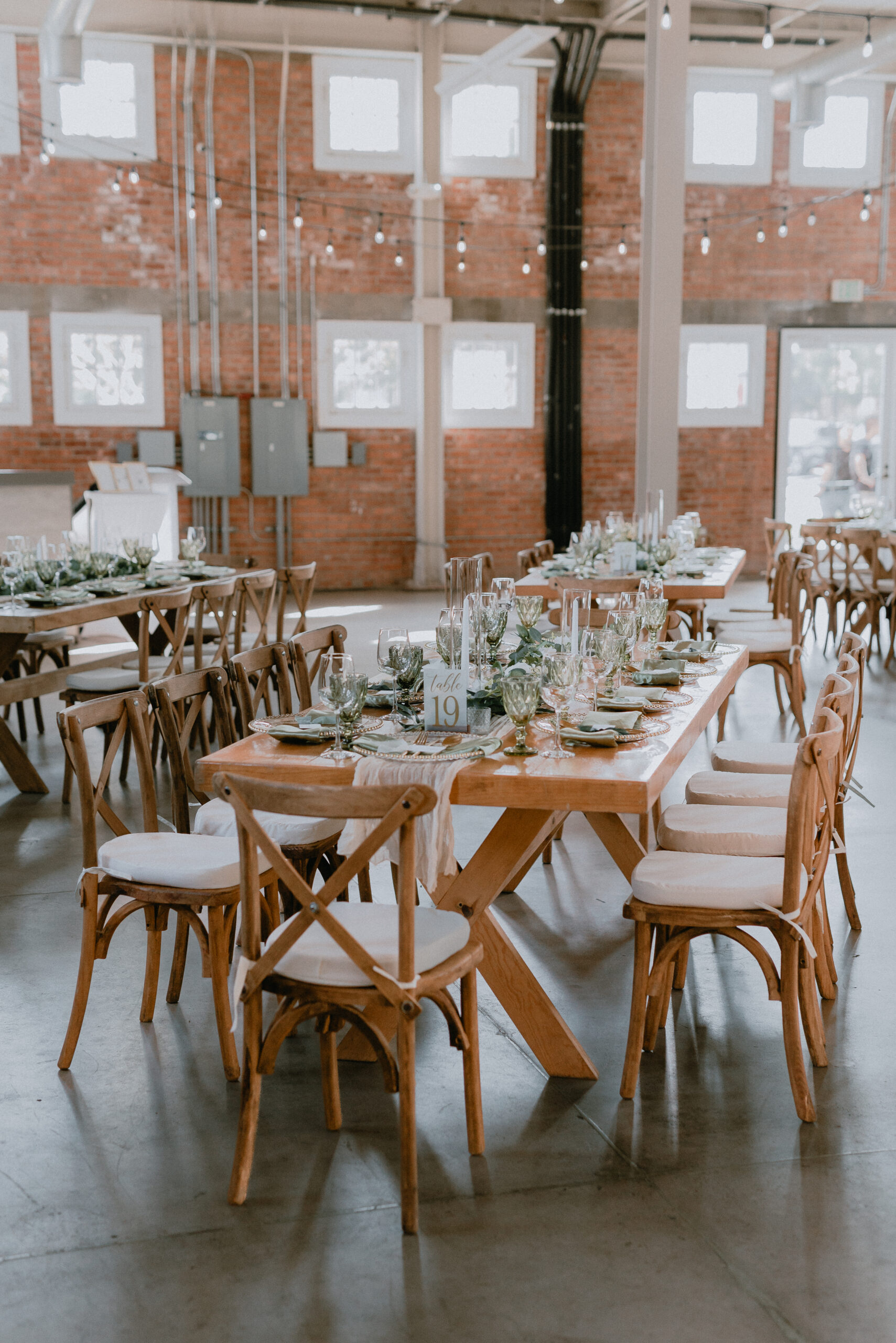 Rustic farm and banquet tables set for a San Diego wedding reception