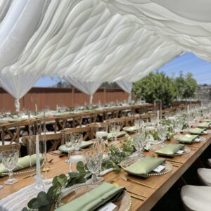 San Diego Event Rentals wave draped canopy with farm tables